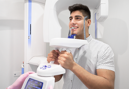 Young man getting a CT cone beam scan of his jaws
