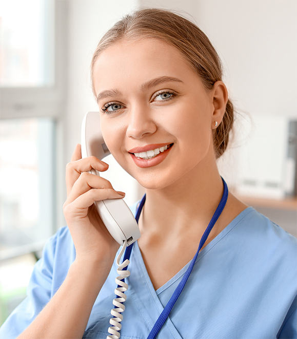 Medford oral surgery team member answering the phone