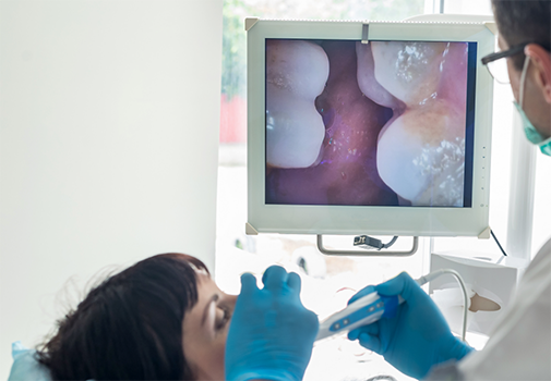 Dentist capturing close up photos of a patient's teeth