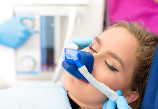 Woman in the dental chair with a nitrous oxide sedation